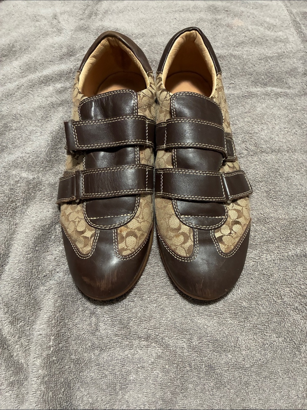 Women Coach Shoe size 10.
Velcro straps with Coach signature logo.